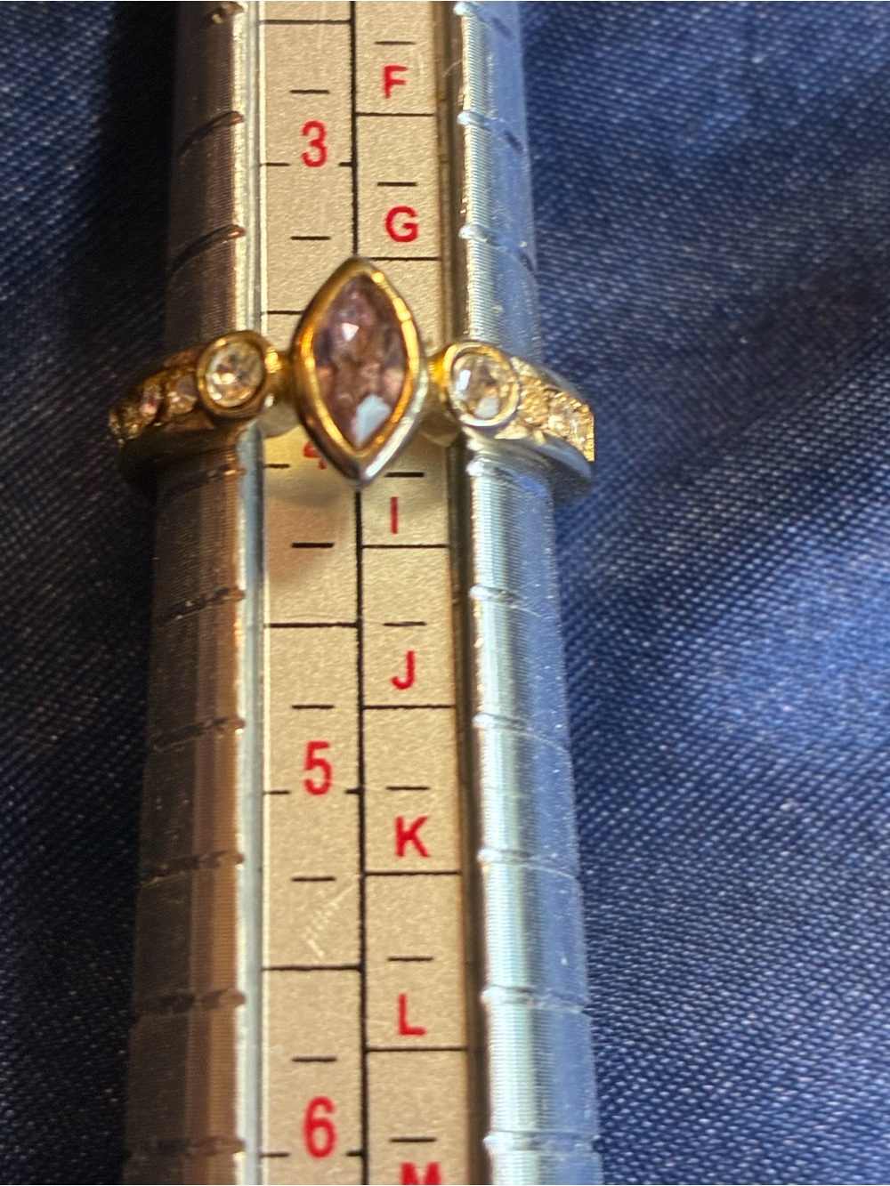 18K yellow gold ring featuring a basil set Marquise cut pink sapphire size 4
